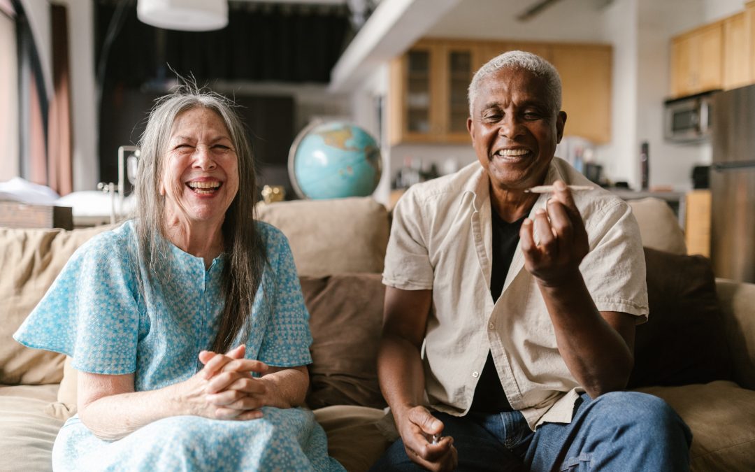 older adult couple sharing a marijuana joint